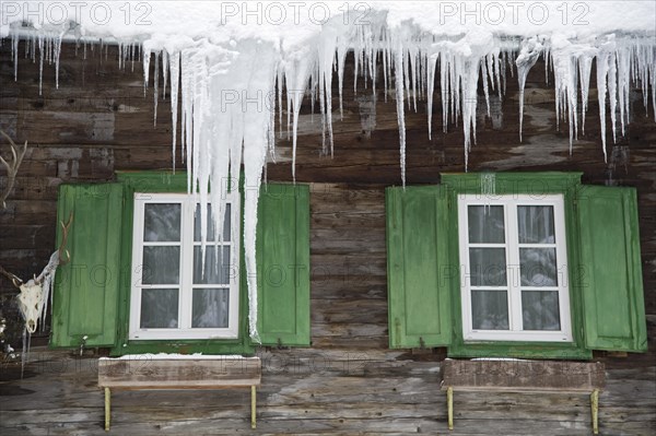 Icicles above the windows of a hunting lodge