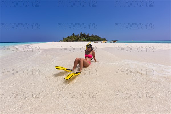 Woman with flippers and diving goggles