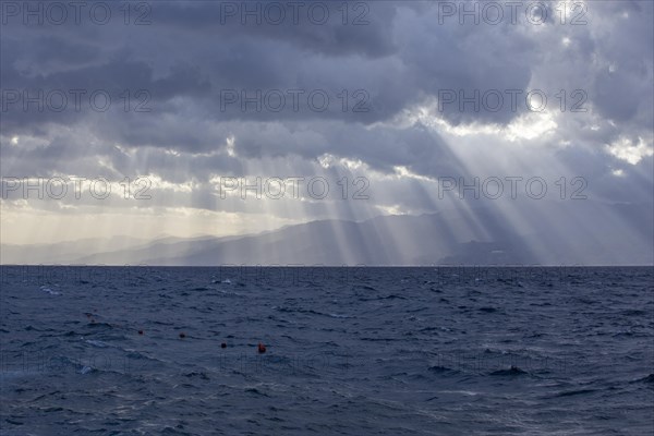 Sun and clouds over the Strait of Messina