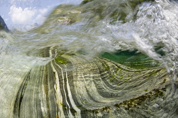 Inside a waterfall in the Verzasca River