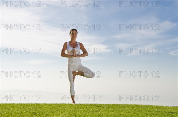 Young woman practising Hatha yoga