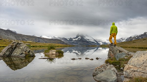 Hiker stands on rock