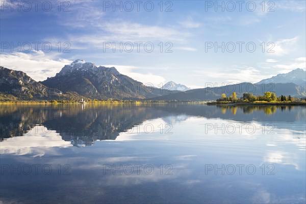 Autumn mood with mountain views on Forggensee lake near Fussen