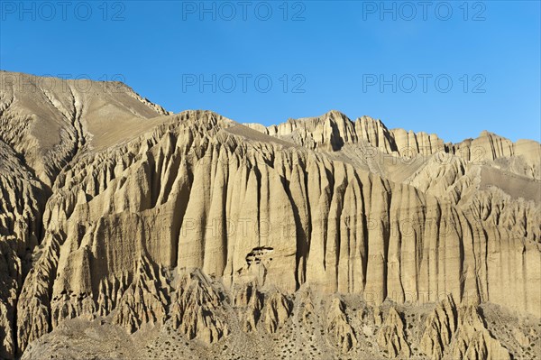 Bizarre erosion landscape with prehistoric caves in the rocks