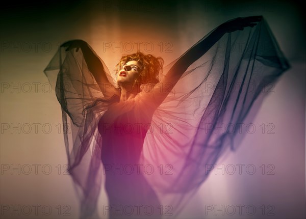 Young woman with wing veil