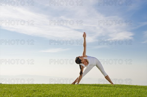 Young woman practising Hatha yoga