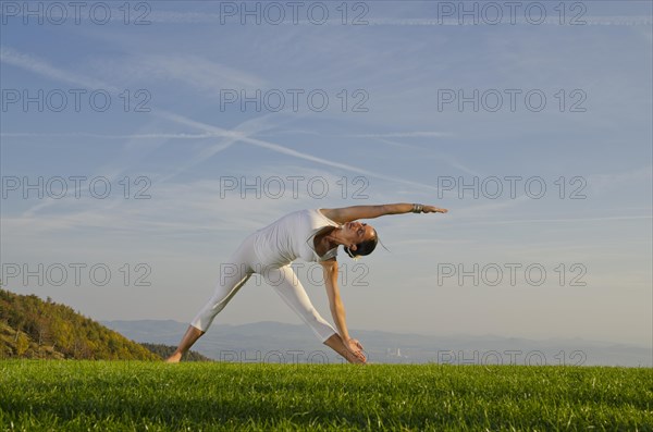 Young woman practising Hatha yoga