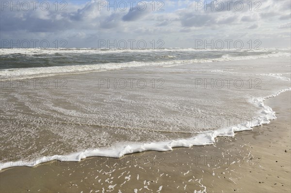 Waves on the beach at the stormy North Sea