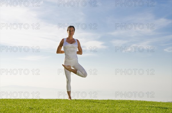 Young woman practising Hatha yoga