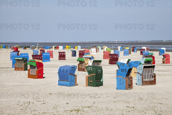 Wicker beach chairs on the beach