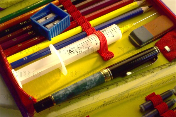 A medical syringe in a pencil case