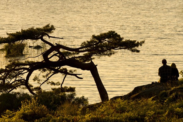 Couple sitting at the lakeside