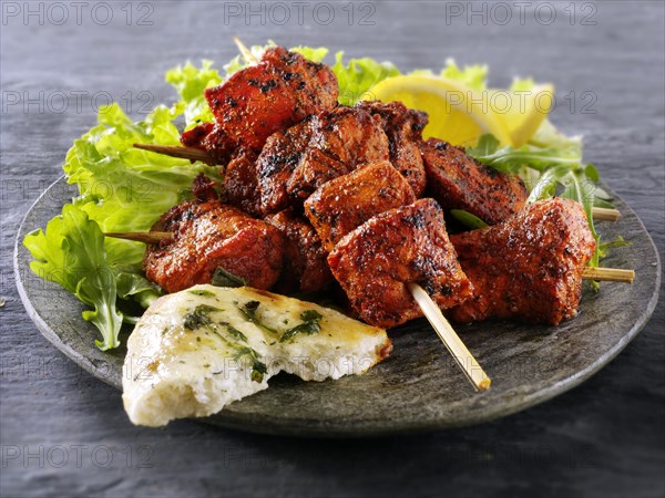 Chicken Tikka with salad and naan bread