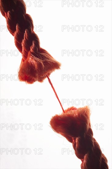 Damaged rope is held together by only one thread