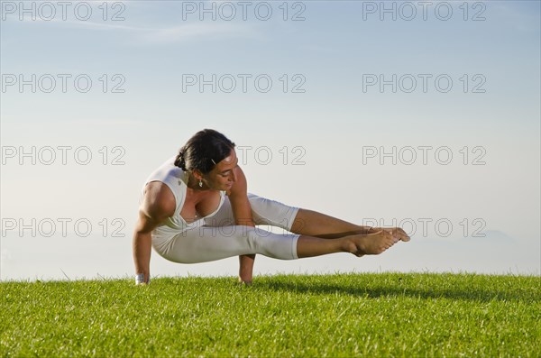 Young woman practising Hatha yoga