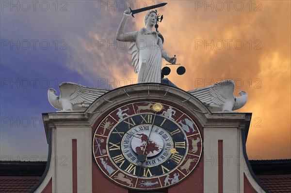 Astronomical clock with a statue of Justice on the Baroque town hall of Bad Windsheim