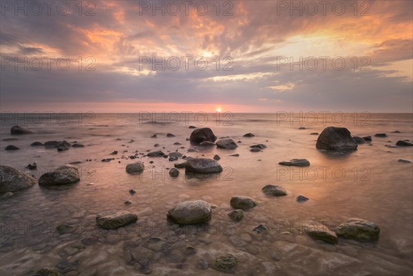 Stones at sunrise at the Baltic Sea coast