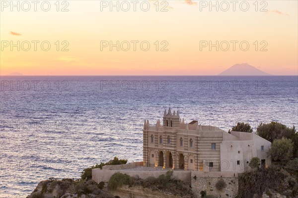 Church Chiesa Santa Maria dell'Isola behind the Stromboli volcano