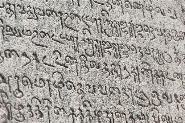 Indian inscriptions carved into a temple wall