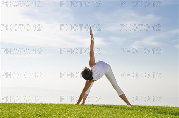 Young woman practising Hatha yoga