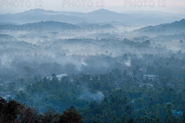 Morning fog over a hilly landscape