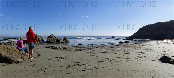 Two women on the sandy beach