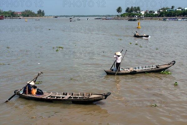 Fisherman working on the Tonle Sap River