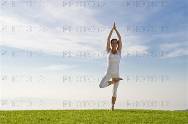 Young woman practising Hatha yoga