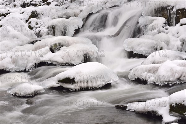 Waterfall covered in snow and ice in the Selke Valley