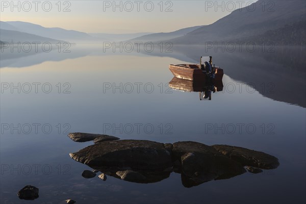 Fishing boat on Loch Arkaig in the early morning