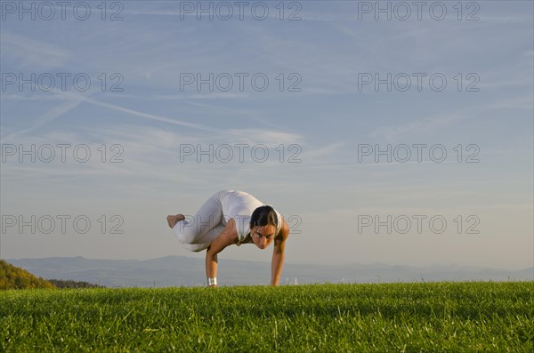 Young woman practising Hatha yoga