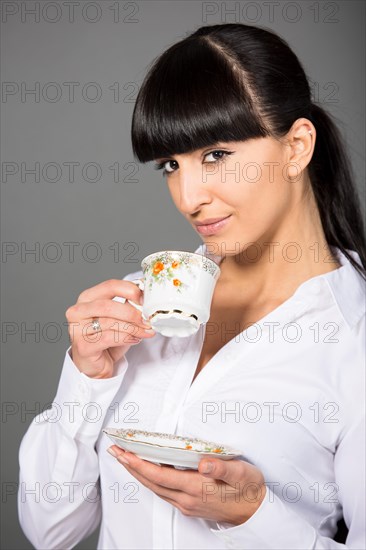 Woman holding a cup of tea