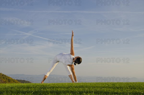 Young woman practising Hatha yoga