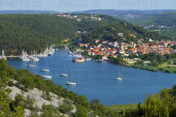 Townscape with sailing ships in the foreground