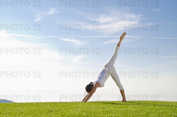 Young woman practising Hatha yoga