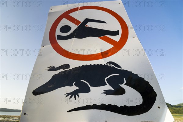 Warning sign for crocodiles and swimming ban