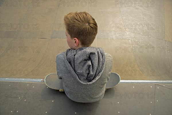 Thirteen-year-old boy with skateboard
