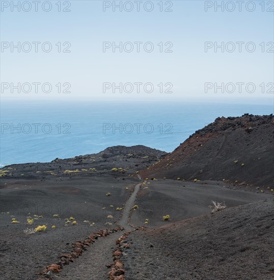 Hiking trail through a lava landscape