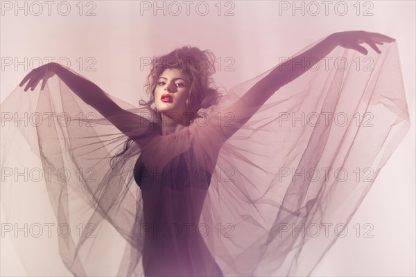 Young woman with wing veil