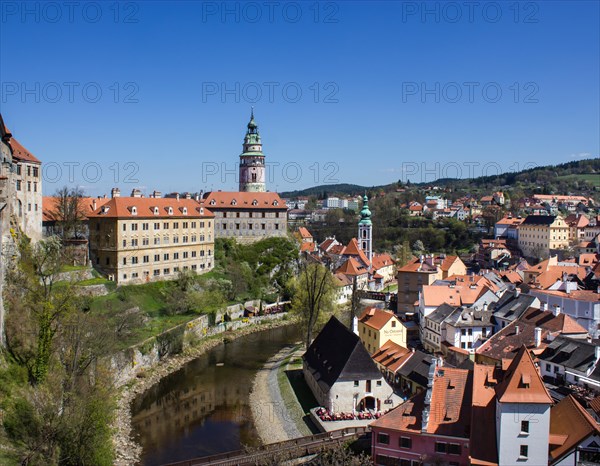 Cesky Krumlov Castle with the castle tower and St. Jost Church