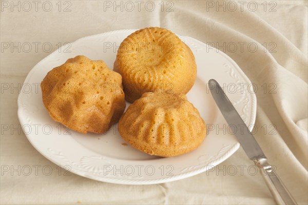 Three items of polenta made from cornmeal baked in ramekins