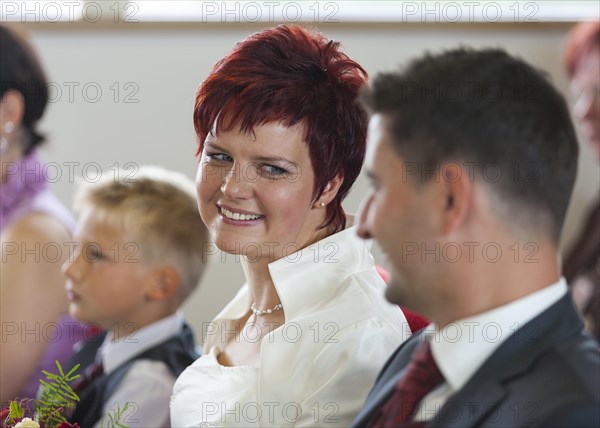 Bride in love looking at the groom during the wedding ceremony