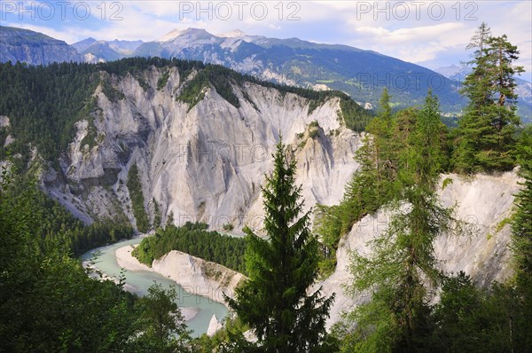 Limestone cliffs at a river bend of the AVorderrhein