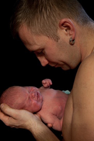 Father holding a baby in his arms