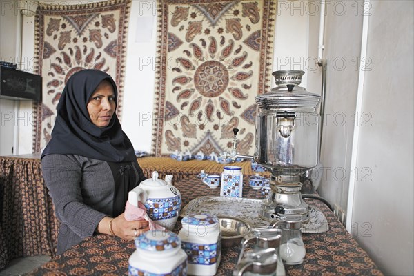 Woman preparing Iranian tea