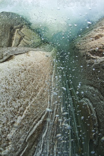 A waterfall seen from underwater