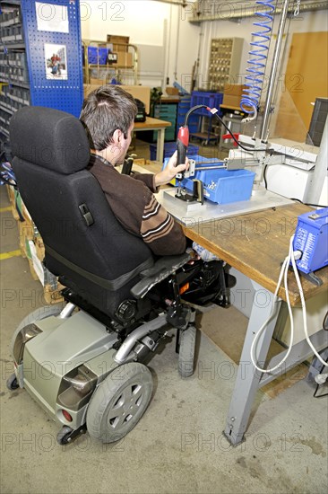 Mentally and physically disabled man at work