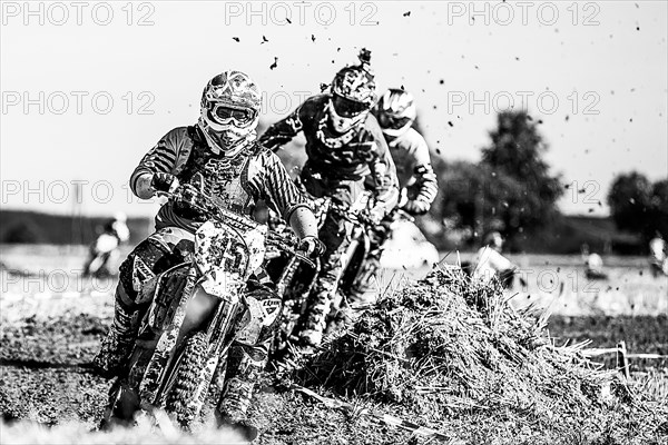 Motocross riders on a field