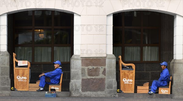 Shoeshine boys waiting for customers