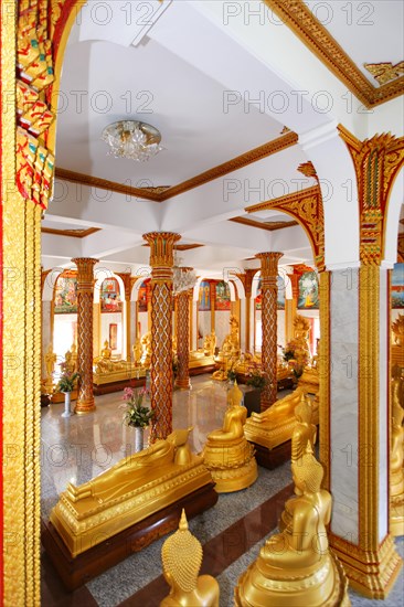 Room with golden Buddha statues